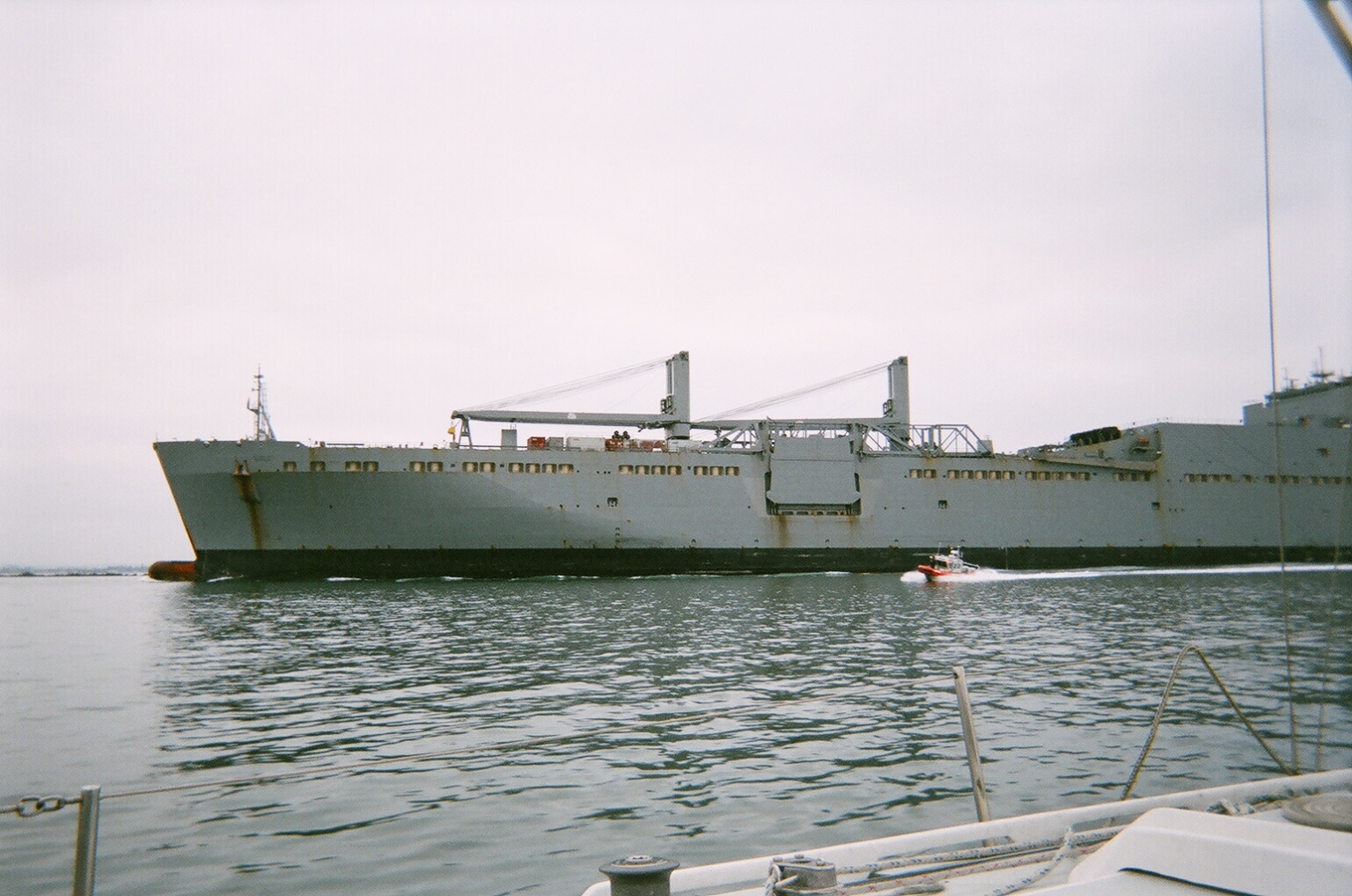 navy freighter with skiff approaching