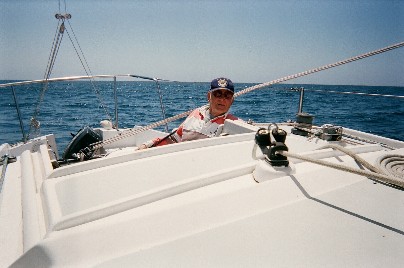 Dad sailing over the blue water again